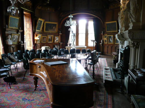 A room with a grand piano in Hospitalfield House